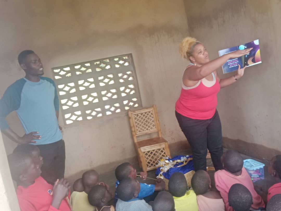 Children and volunteers at Inzozi Learning Center — moment 10