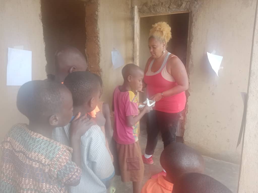 Children and volunteers at Inzozi Learning Center — moment 7